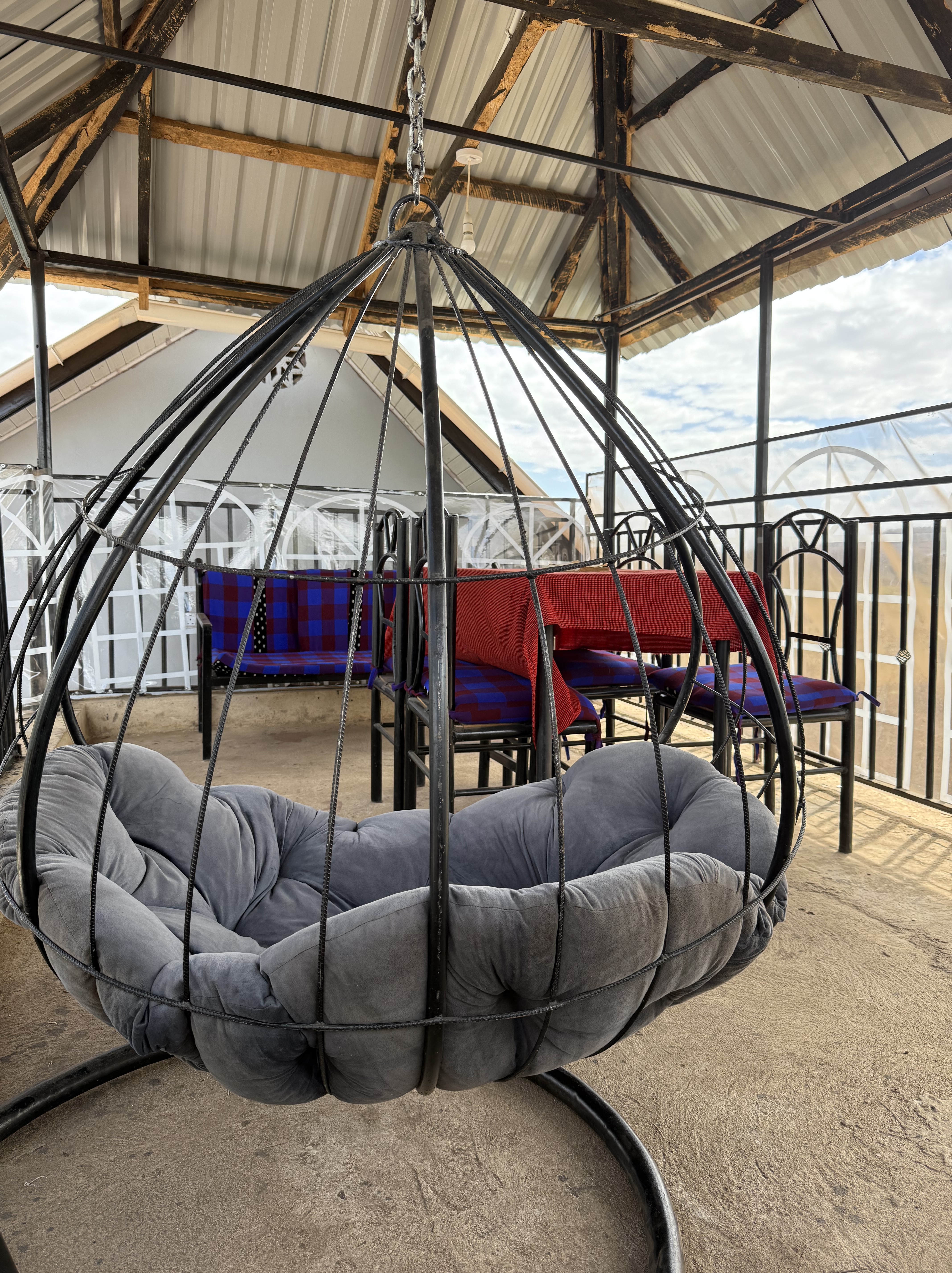 A hanging chair with a basket seat